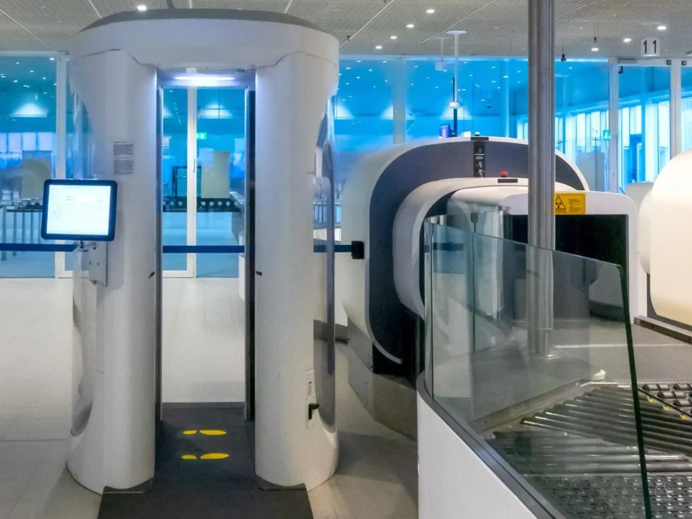 Photograph of an airport CT scanner.